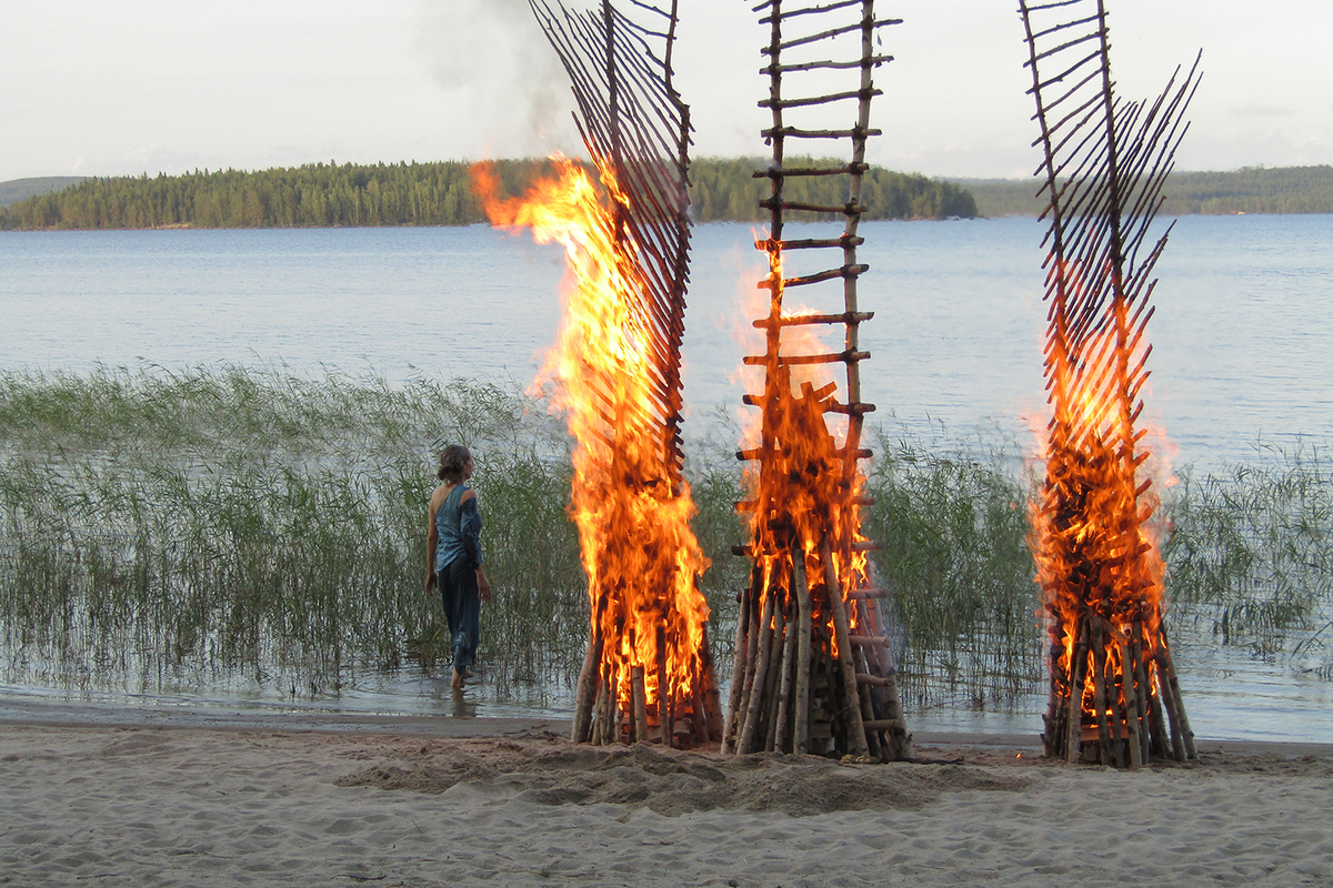Burning of the birch ladders, Koli, Finland. 2018.  Live performance event.  Photographs and videos are part of the Pori Art Museum Collection. (Photograph: Leena Jarva)